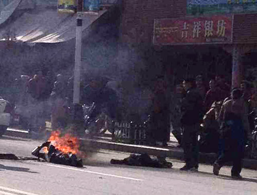 Dorje Rinchen collapses to the ground in Labrang.