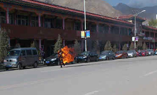 Dorje Rinchen ablaze after he set fire to himself today (October 23).